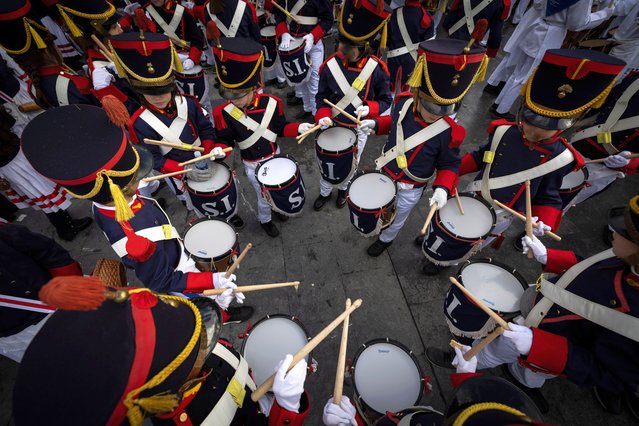 Participants of the “Tamborrada” festival play their drums in San Sebastian, Basque Country, northern Spain, 20 January 2025. Some 22,700 adults and 4,600 children took part in the festivity, which takes place every year on 20 January to honor the town's patron, Saint Sebastian. (Photo by Javier Etxezarreta/EPA/EFE)