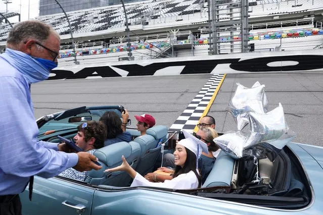 A student of Matanzas High School, which was closed due to coronavirus disease (COVID-19) restrictions, crosses the finish line as she receives her diplomas at her graduation at Daytona International Speedway in Daytona Beach, Florida, U.S. May 31, 2020. (Photo by Eve Edelheit/Reuters)