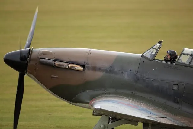 A Hawker Hurricane Mk XIIa 5711 (G-HURI) fighter aircraft prepares to perform an aerobatic display at the IWM Duxford on October 18, 2012 in Duxford, England. The aeroplane, similar to those that defended British shores during the Battle of Britain in World War II, is due to be auctioned by Bonhams in their sale of “Collectors' Motor Cars and Automobilia” at Mercedes-Benz World Brooklands on December 3, 2012. The plane was built in 1942 and joined the Royal Canadian Air Force the following year, where it remained for the duration of the war, it is expected to fetch up to 17 million GBP.  (Photo by Oli Scarff)