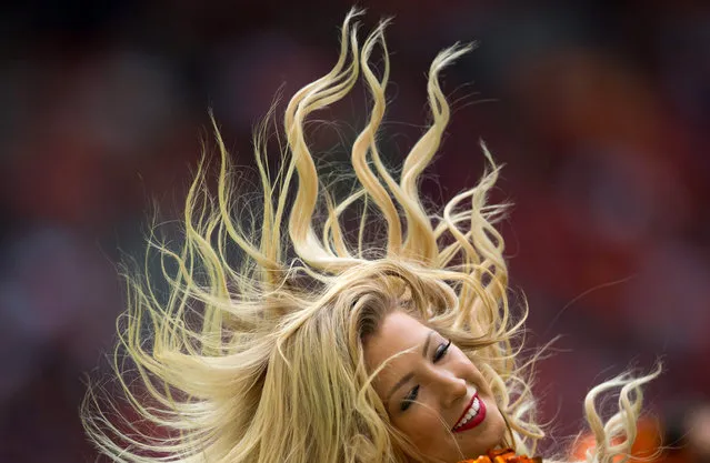A cheerleader from the B.C. Lions' “Felions” performs during a CFL Football game against the Ottawa Redblacks in Vancouver, British Columbia, Sunday, Sept. 13, 2015. (Photo by Darryl Dyck/The Canadian Press via AP Photo)