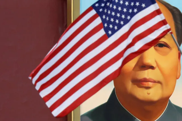 A U.S. flag flutters in front of a portrait of the late Chinese Chairman Mao Zedong at Tiananmen gate during the visit by U.S. President Donald Trump to Beijing, China, November 8, 2017. (Photo by Damir Sagolj/Reuters)