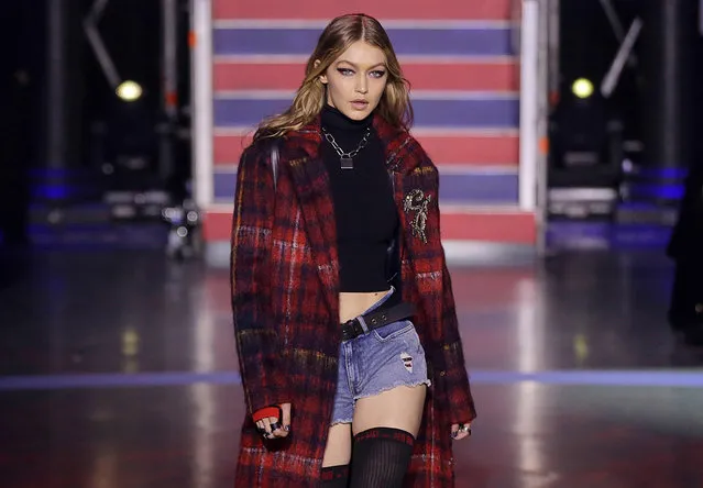 In this Tuesday, September 19, 2017, file photo, model Gigi Hadid wears a creation by designer Tommy Hilfiger at the Spring/Summer 2018 runway show in London. Hadid says she will not be walking the Victoria's Secret fashion show in Shanghai next week. In a post on her Twitter account Friday, Hadid did not explain why she would be missing the show and Victoria’s Secret refused to comment on the issue. (Photo by Alastair Grant/AP Photo)