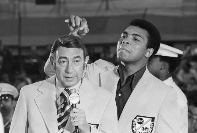 Muhammad Ali, former world heavyweight boxing champion, toys with the finely combed hair of television sports commentators Howard Cosell before the start of the Olympic boxing trials, Aug. 7, 1972, in West Point, NY. (Photo by AP Photo)