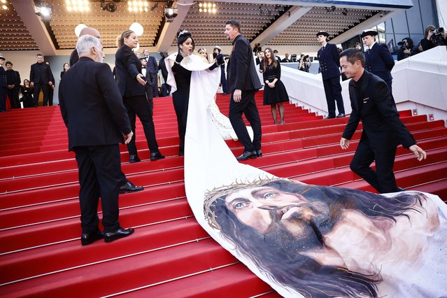 A guest wearing a dress depicting Jesus Christ poses on the red carpet during arrivals for the screening of the film “Le Comte de Monte-Cristo” (The Count of Monte-Cristo) Out of competition at the 77th Cannes Film Festival in Cannes, France, May 22, 2024. (Photo by Yara Nardi/Reuters)
