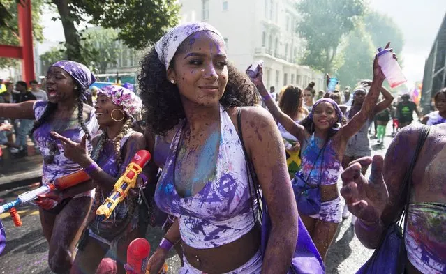 Revellers take part in the Children's Day parade of the Notting Hill Carnival in London, Britain, 28 August 2016. The street festival celebrates this year its 52nd anniversary and more than a million people are expected to attend on 28 and 29 August. (Photo by Will Oliver/EPA)