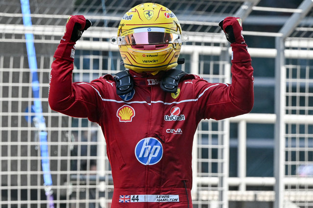 Ferrari's British driver Lewis Hamilton celebrates winning the sprint race of the Formula One Chinese Grand Prix at the Shanghai International Circuit in Shanghai on March 22, 2025. (Photo by Greg Baker/AFP Photo)