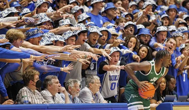 Jacksonville's Gyasi Powell, right, in-bounds the ball in front of the Duke student section during an NCAA college basketball game in Durham, N.C., Monday, November 7, 2022. (Photo by Ben McKeown/AP Photo)