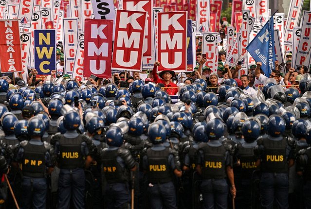 Policemen stand in formation during a Labor Day demonstration in Manila, Philippines on May 1, 2025. (Photo by Noel Celis/Reuters)