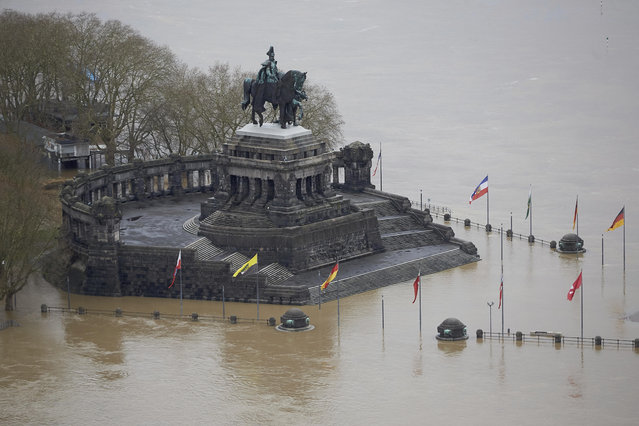 The monument depicting German emperor Wilhelm I.  at the confluence of river Moselle and river Rhine is flooded near Koblenz, Germany, Sunday, January 7, 2018. (Photo by Thomas Frey/DPA via AP Photo)