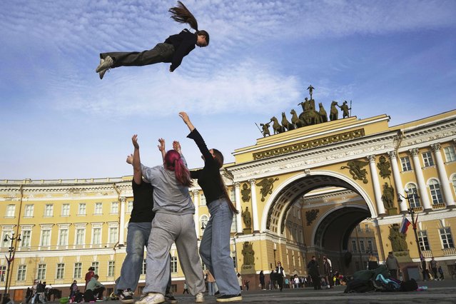Youths practice their skills in cheerleading outside Palace Square in St. Petersburg, Russia, Tuesday, May 27, 2025. (Photo by Dmitri Lovetsky/AP Photo)