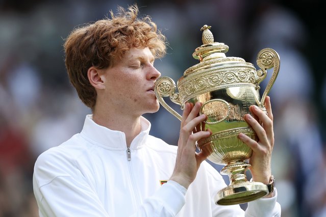 Jannik Sinner kisses his trophy after winning the Wimbledon final over Carlos Alcaraz on Sunday, July 13, 2025. It was the first Wimbledon title for Sinner, the world’s top-ranked tennis player. (Photo by Julian Finney/Getty Images)