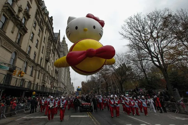 The Hello Kitty balloon floats down Central Park West during the 88th Macy's Thanksgiving Day Parade in New York November 27, 2014. (Photo by Eduardo Munoz/Reuters)