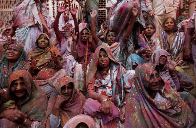 Widows daubed in colours take part in Holi celebrations in the town of Vrindavan in the northern state of Uttar Pradesh, India, February 27, 2018. (Photo by Adnan Abidi/Reuters)