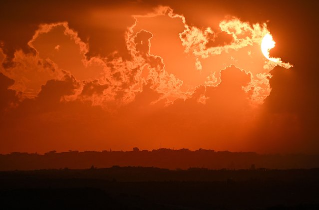 The sun sets over northern Gaza ruins, amid the ongoing conflict between Israel and the Palestinian Islamist group Hamas, as seen from Sderot, Israel, on February 2, 2024. (Photo by Dylan Martinez/Reuters)