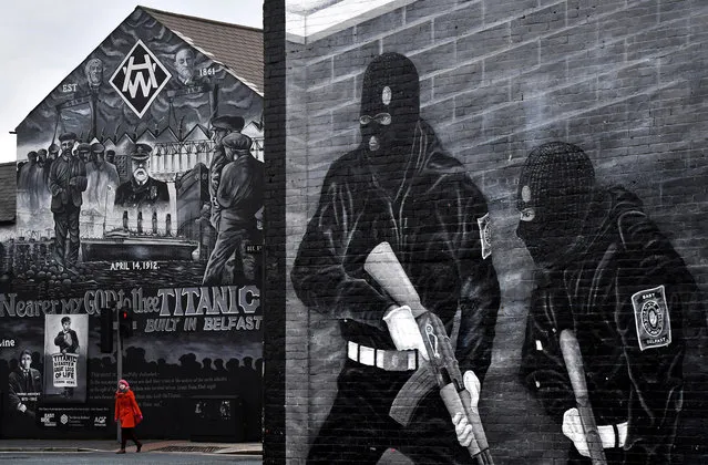 A woman crosses the street against the backdrop of the John Stewart painted mural dedicated to the men, women and children who lost their lives on the Titanic on March 1, 2018 in Belfast, Northern Ireland. (Photo by Charles McQuillan/Getty Images)