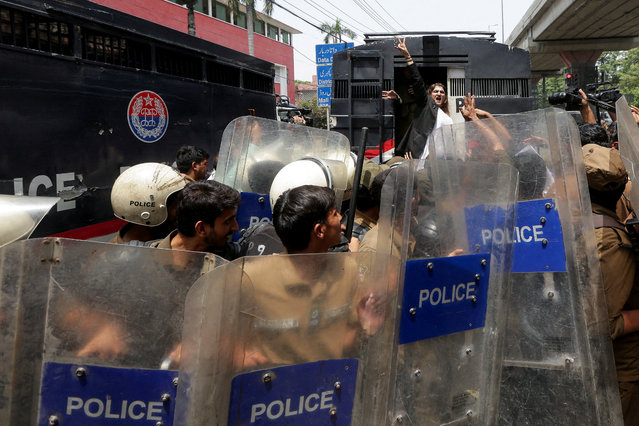 A supporter of Pakistan's former Prime Minister Imran Khan and his party, chants slogans while being detained by police officers during a nationwide protest demanding Khan's release on the second anniversary of his arrest, in Lahore, Pakistan on August 5, 2025. (Photo by Mohsin Raza/Reuters)