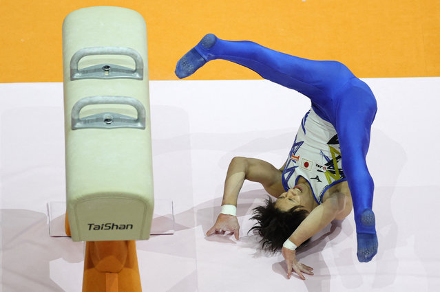 Hiroto Ishizawa of Japan falls while competing on the pommel horse during qualifications at the World Artistic Gymnastics Championships in Jakarta, Indonesia on October 19, 2025. (Photo by Ajeng Dinar Ulfiana/Reuters)