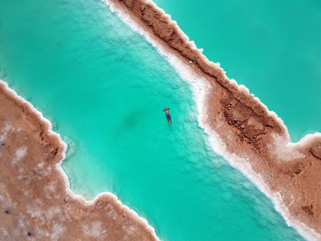 A view of salt lakes in Siwa Oasis, located in the heart of the Western Desert in Egypt on July 28, 2025. Siwa Oasis draws attention with its historical heritage and natural beauty. Known for its ancient temples and traditional Berber culture, the region has become increasingly popular among both local and international tourists in recent years. Its salt lakes and hot sand baths, believed to be beneficial for rheumatism and skin conditions, have turned the oasis into a healing destination for many visitors. (Photo by Fareed Kotb/Anadolu via Getty Images)