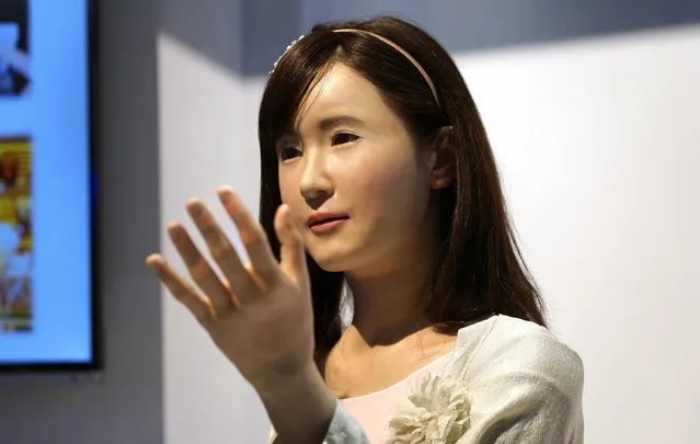 ChihiraAico, a communication android robot, gestures to show goers at the Toshiba booth at the International Consumer Electronics show (CES) in Las Vegas, Nevada January 6, 2015. The robot is controlled by pneumatics. (Photo by Rick Wilking/Reuters)