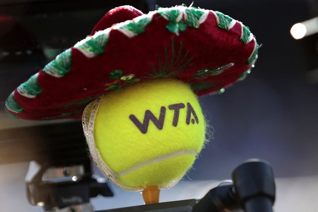 A tennis ball with a Mexican hat is seen during the WTA 2024 women's singles round of 16 match in Zapopan, Mexico, on September 11, 2024. (Photo by Ulises Ruiz/AFP Photo)