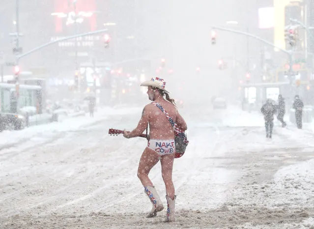 The Naked Cowboy performer crosses Seventh Avenue as snow falls in Times Square in New York City on Monday, February 1, 2021. A major nor'easter threatens to dump as much as 2 feet of snow on parts of the Tri-State area over the next two days. (Photo by John Angelillo/UPI/Rex Features/Shutterstock)