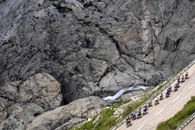 The pack climbs the Furka pass during the fifth stage, a 211 km race from Fiesch to La Punt, of the 86th Tour de Suisse UCI World Tour cycling race in Goms, Switzerland, Thursday, June 15, 2023. (Photo by Matthias Schrader/AP Photo)
