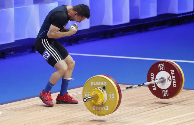 Valentin Iancu of Romania in action during the Men's 55kg category final at the 2021 EWF European Weightlifting Championships, in Moscow, Russia, 04 April 2021. (Photo by Maxim Shipenkov/EPA/EFE)