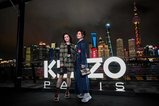 Hong Kong singers Gillian Chung (L) and Charlene Choi pose on the red carpet ahead of the Kenzo fashion show at the North Bund Bay in Shanghai on July 28, 2023. (Photo by Jade Gao/AFP Photo)