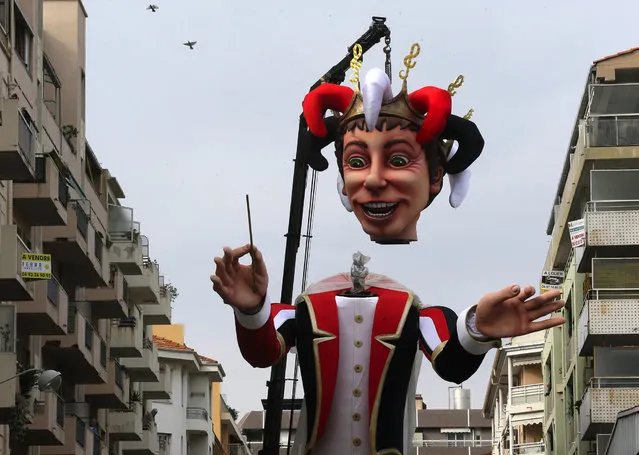 A large mannequin figure depicting the King of the Carnival is set up during preparations for the 131st Nice carnival parade, Friday, February 13 , 2015, in Nice, southeastern France. (Photo by Lionel Cironneau/AP Photo)
