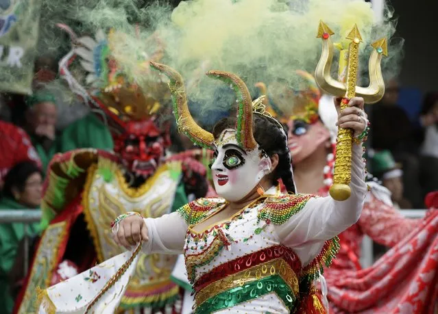 Members of the “Diablada” group perform during the Carnival parade in Oruro, February 14, 2015. (Photo by David Mercado/Reuters)