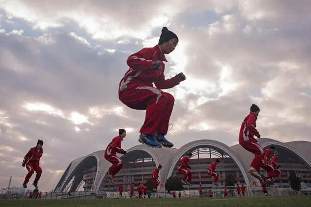 Female students of the Pyongyang International Football Academy take part in a training and aerobics session in Pyongyang on December 2, 2016. (Photo by Ed Jones/AFP Photo)