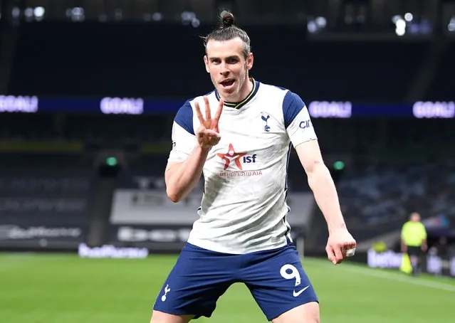 Gareth Bale of Tottenham Hotspur celebrates after scoring his hat-trick during the Premier League match between Tottenham Hotspur and Sheffield United at Tottenham Hotspur Stadium on May 02, 2021 in London, England. Sporting stadiums around the UK remain under strict restrictions due to the Coronavirus Pandemic as Government social distancing laws prohibit fans inside venues resulting in games being played behind closed doors. (Photo by Shaun Botterill/Getty Images)