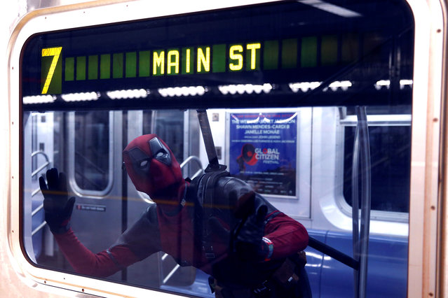A Comic Con fan with cosplay costume, gives a pose on the Number 7 train during 2018 New York Comic-Con at the Javits Convention Center in New York, United States on October 05, 2018. (Photo by Atilgan Ozdil/Anadolu Agency/Getty Images)