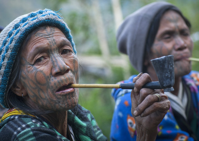 A group of tattooed women from the Muun tribe who inhabit the hills of the Arakan state. The design, known as the letter B-pattern, is common in the Mindat area. It is composed of dots, lines and occasionally circles, in February, 2015, in Myanmar, Burma. (Photo by Eric Lafforgue/Barcroft Media)