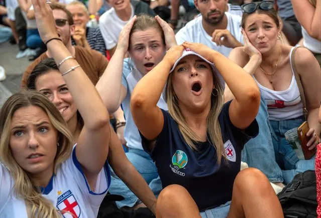 England football fans react during the first half of the UEFA Euro Women's Championship final on July 31, 2022 in London, United Kingdom. England take on Germany in the final of The UEFA European Women's Championship, played at Wembley Stadium. (Photo by Chris J. Ratcliffe/Getty Images)