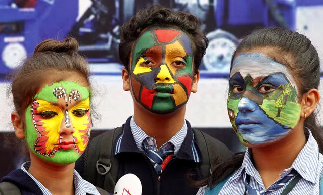 Indian school children stand with their face painted to promote the Clean Indian Movement, or Swachh Bharat Mission, as they participate in an event held to mark World Toilet Day, in New Delhi, India, 19 November 2018. November 19 has been designated as World Toilet Day by the United Nations, to draw attention to the issue of sanitation and to create awareness about the importance of toilets. The event was organised by the  India-based social service organization Sulabh International that works to promote environmental sanitation. (Photo by Harish Tyagi/EPA/EFE)
