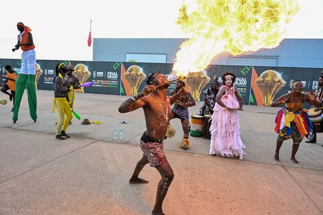 Entertainers perform ahead of the Africa Cup of Nations (CAN) 2024 official draw at Parc des Expositions in Abidjan, southeastern Ivory Coast on October 12, 2023. (Photo by AFP Photo/Stringer)