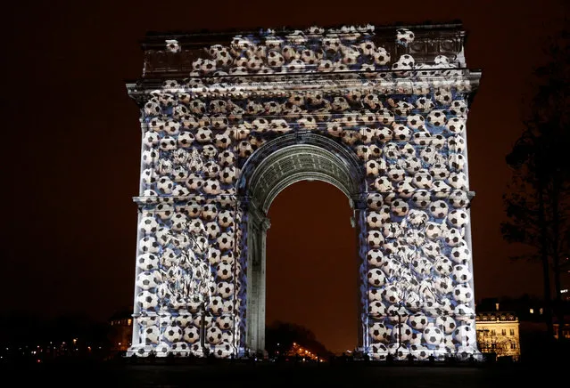 View of a light show on the city's iconic Arc de Triomphe monument during the New Year celebration in Paris, France, December 31, 2016. (Photo by Jacky Naegelen/Reuters)