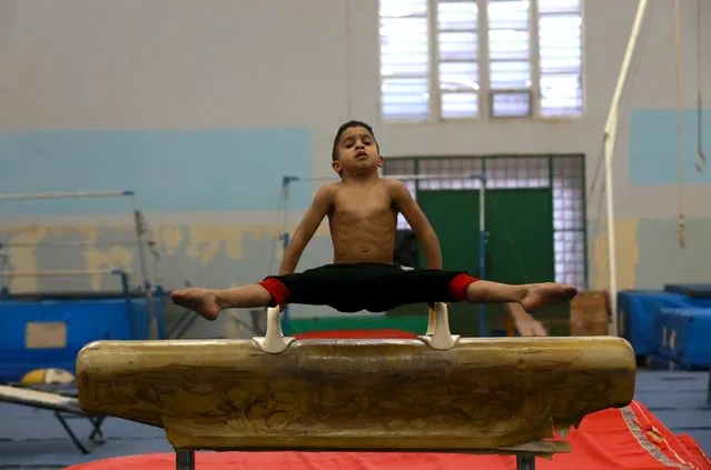 A boy trains on gymnastic equipment during practice at a gymnastic school in Benghazi, Libya February 8, 2016. (Photo by Esam Omran Al-Fetori/Reuters)