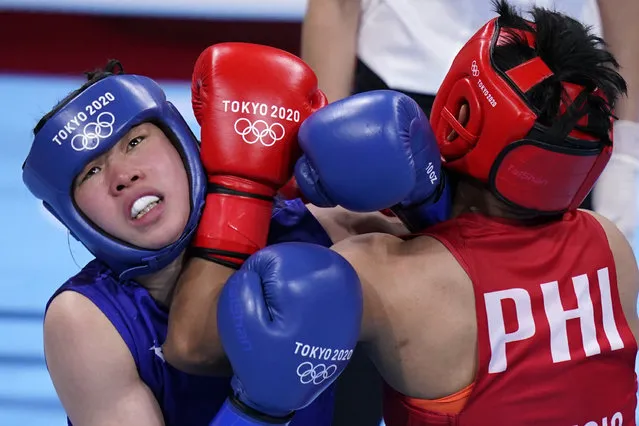 Philippines's Nesthy Petecio, right, exchanges punches with Japan's Sena Irie during their women's featherweight 60-kg final boxing match at the 2020 Summer Olympics, Tuesday, August 3, 2021, in Tokyo, Japan. (Photo by Frank Franklin II/AP Photo)