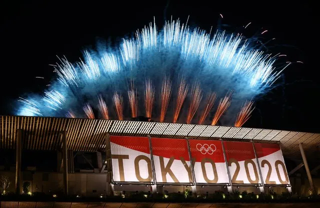Fireworks explode above Japan National Stadium during the closing ceremony of Tokyo 2020 Olympic Games in Tokyo, Japan on August 08, 2021. (Photo by Thomas Peter/Reuters)