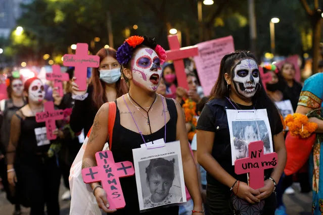 Women hold a protest ahead of the Day of the Dead against gender violence and femicide in Mexico City, Mexico on October 30, 2022. (Photo by Raquel Cunha/Reuters)