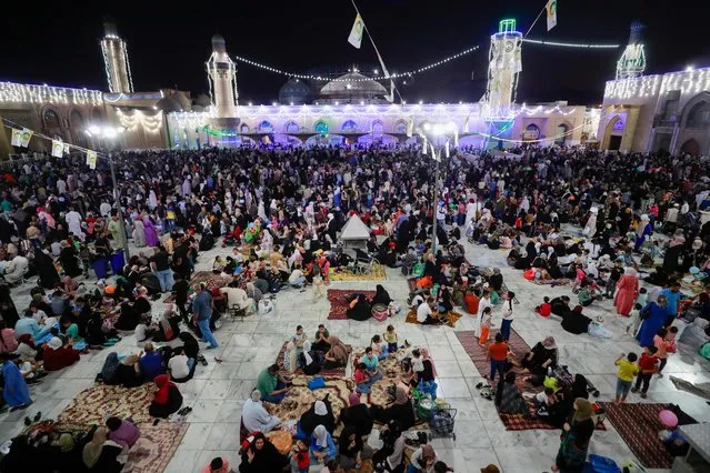 Iraqi Sunni Muslims gather at the shrine of Sheikh Abdul Qadir al-Kilani in Baghdad on September 26, 2023 during the Muslim celebration of the birth of the Prophet Muhammed.  (Photo by Ahmad Al-Rubaye/AFP Photo)