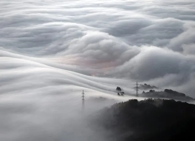 A general view of a mountainous landscape in Pamplona covered in a thick blanket of smog on 23 December 2015, in Pamplona, northern Spain. (Photo by Jesus Diges/EPA)