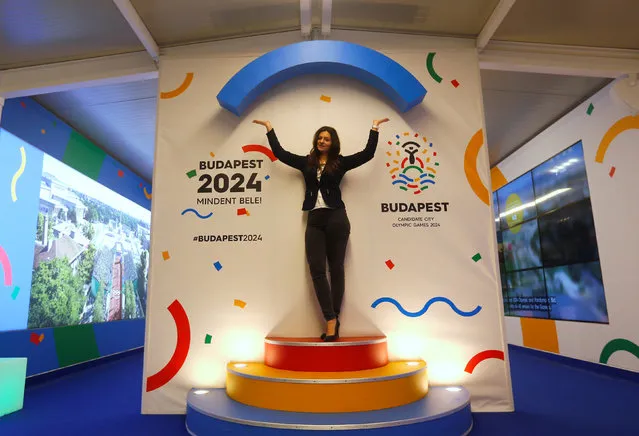 A hostess poses with Hungary's Olympic logo at a promotional spot as the Hungarian capital bids for the 2024 Olympic Games, in central Budapest, Hungary January 31, 2017. (Photo by Laszlo Balogh/Reuters)