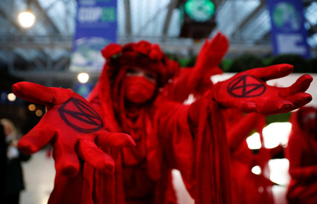A Red Rebellion activist participates in a protest at Glasgow Central Station during the UN Climate Change Conference (COP26) in Glasgow, Scotland, Britain, November 1, 2021. (Photo by Lee Smith/Reuters)