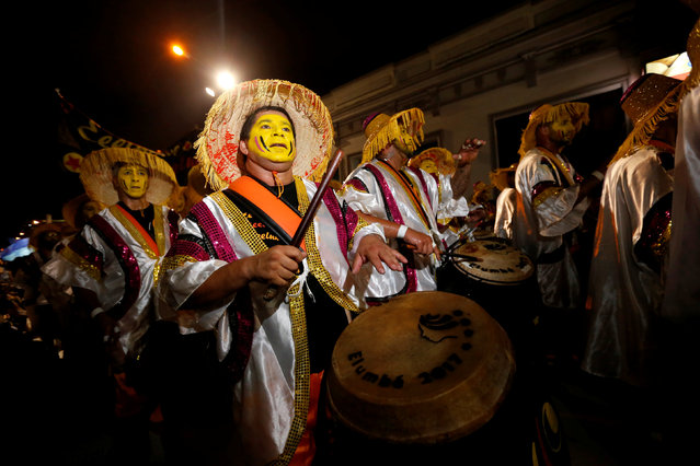Members of a comparsa, a Uruguayan carnival group, play the drums during the Llamadas parade, a street fiesta with traditional Afro-Uruguayan roots, in Montevideo February 10, 2017. (Photo by Andres Stapff/Reuters)