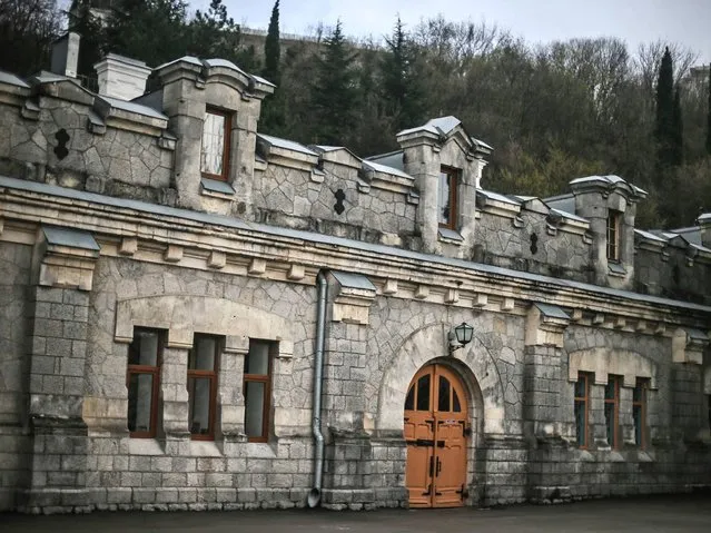 An exterior profile view showing the main facade built with light-grey Crimean stone of the Massandra winery's building in Massandra village near Yalta. The wine cellars are underneath the building which is a reminiscent of a medieval castle. (Photo by Sergei Ilnitsky/EPA)