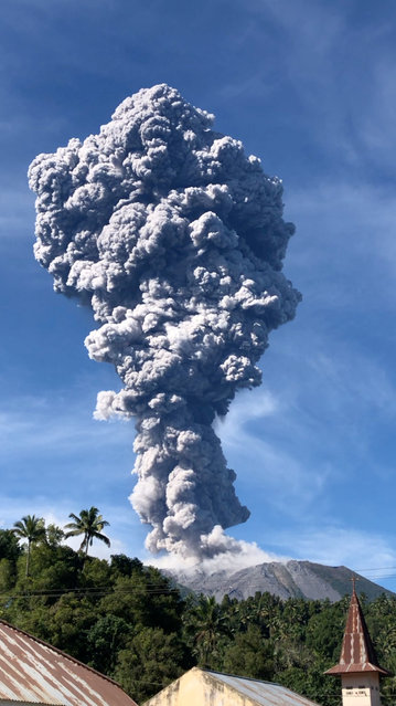 A column of ash rises over the Gunung Ibu (Mount Ibu) volcano, in Halmahera island, North Maluku province, Indonesia May 13, 2024 in this screen grab obtained from social media video. (Photo by Fhe Booroto via Reuters)