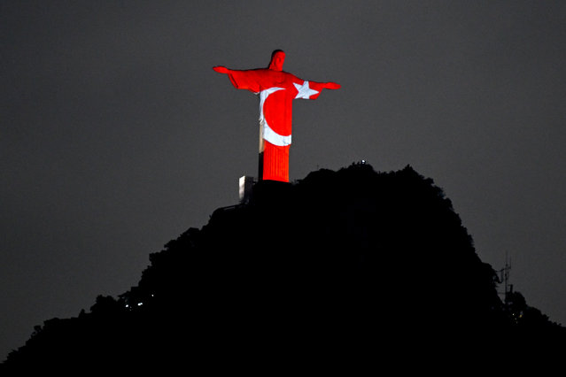 The Turkish flag is projected on the statue of Christ the Redeemer on Mount Corcovado in Rio de Janeiro, February 16, 2023, during a tribute to the victims of the earthquake that struck Turkey and Syria. (Photo by Mauro Pimentel/AFP Photo)